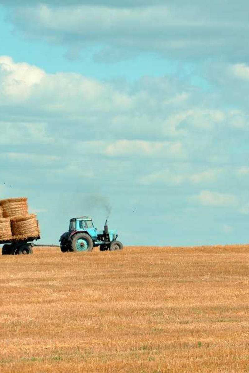 Busy street scene in downtown Vancouver with reflections in the wet pavement